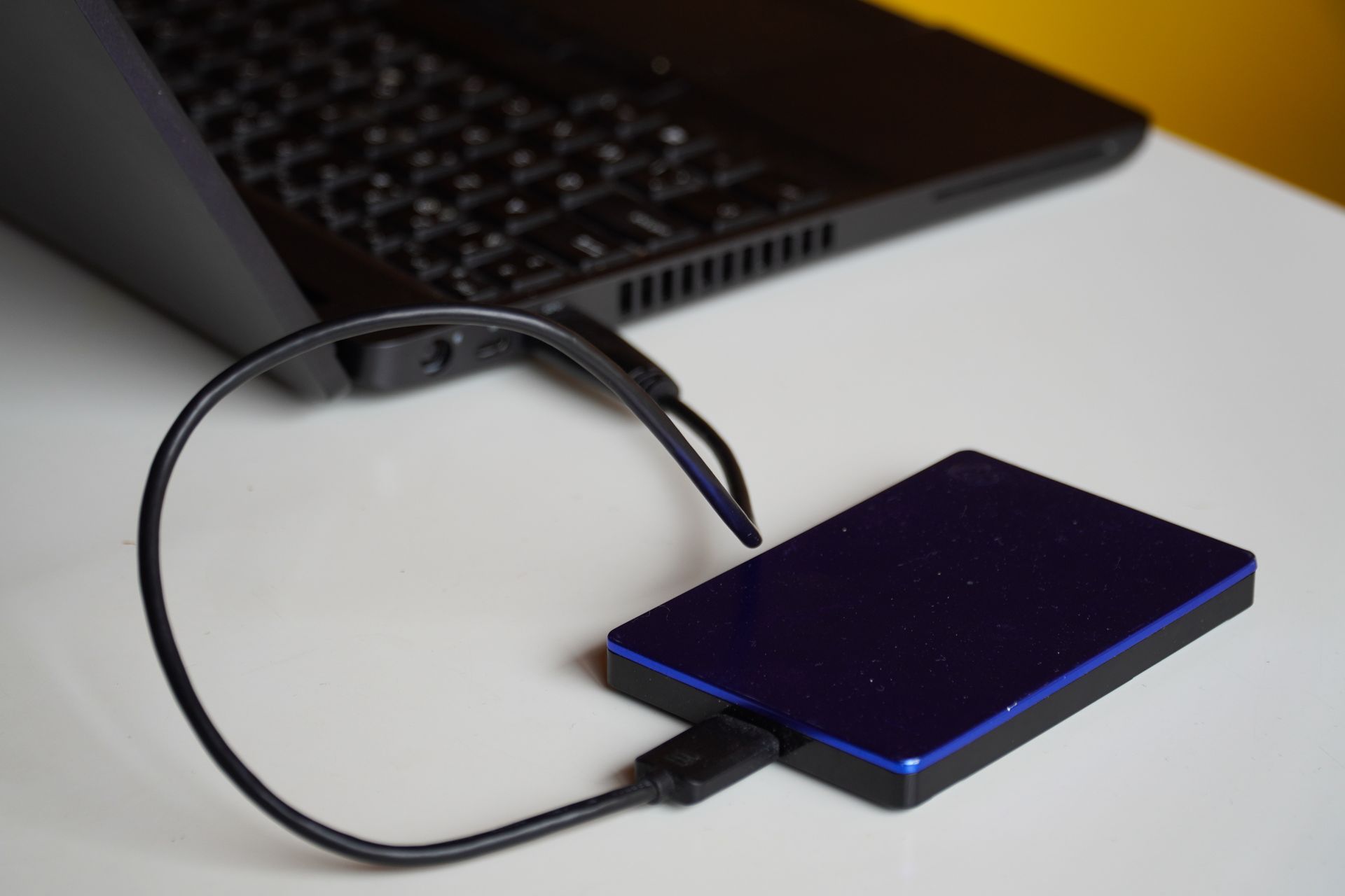 External drive connected to a computer as part of a backup process